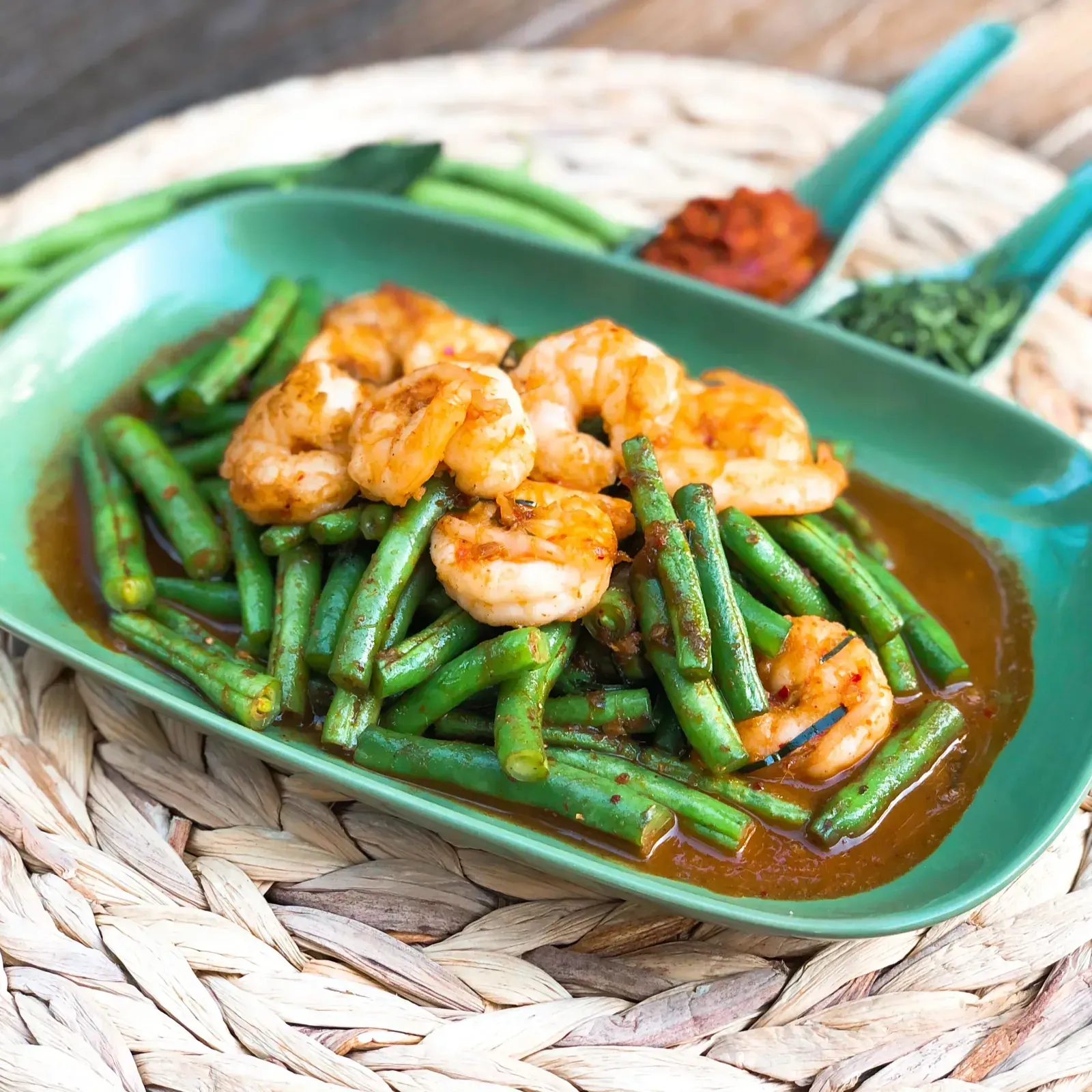 Sauteed green beans in red curry paste with a medley of Thai spices