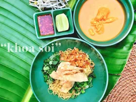 Khao Soi coconut curry egg noodles topped with crispy noodles, shallots and lime
