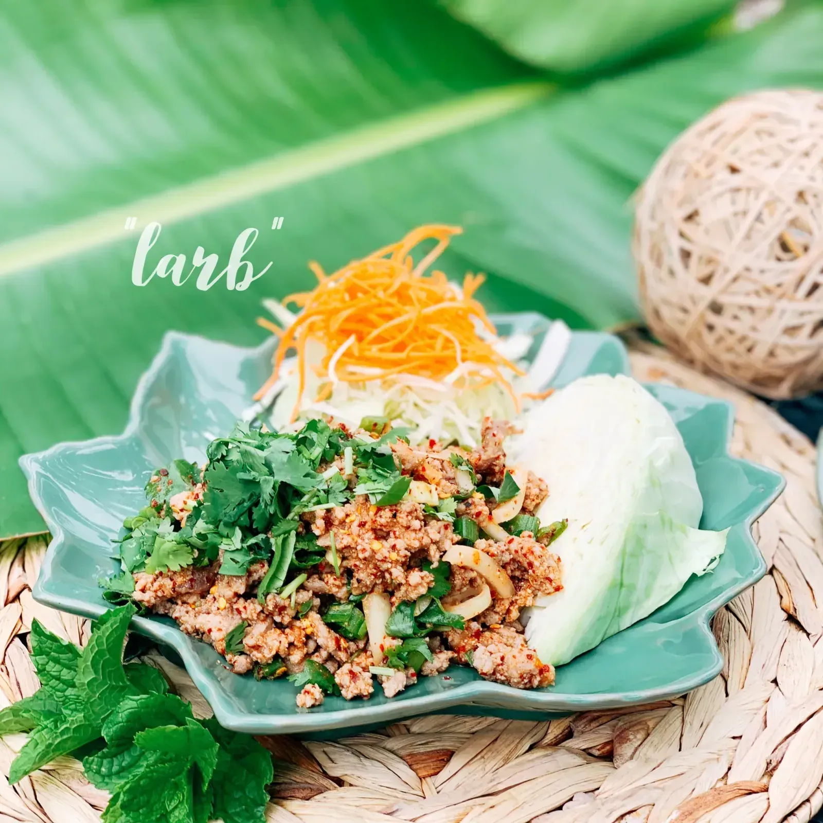 Thai larb minced meat salad tossed with lemongrass, herbs and spicy lime dressing