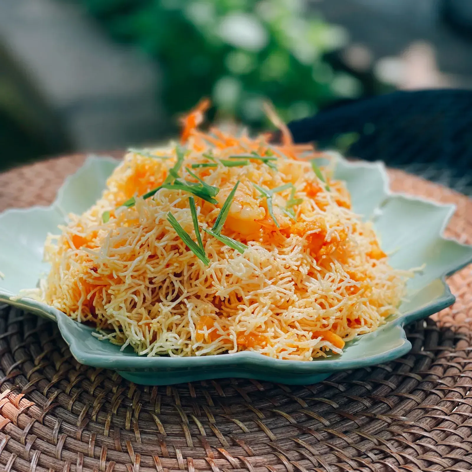 Crispy Mee Krob rice noodles glazed in sweet tangy sauce with shrimp and chicken