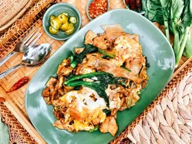 Pad See-Iew wide rice noodles stir-fried with Chinese broccoli and brown egg