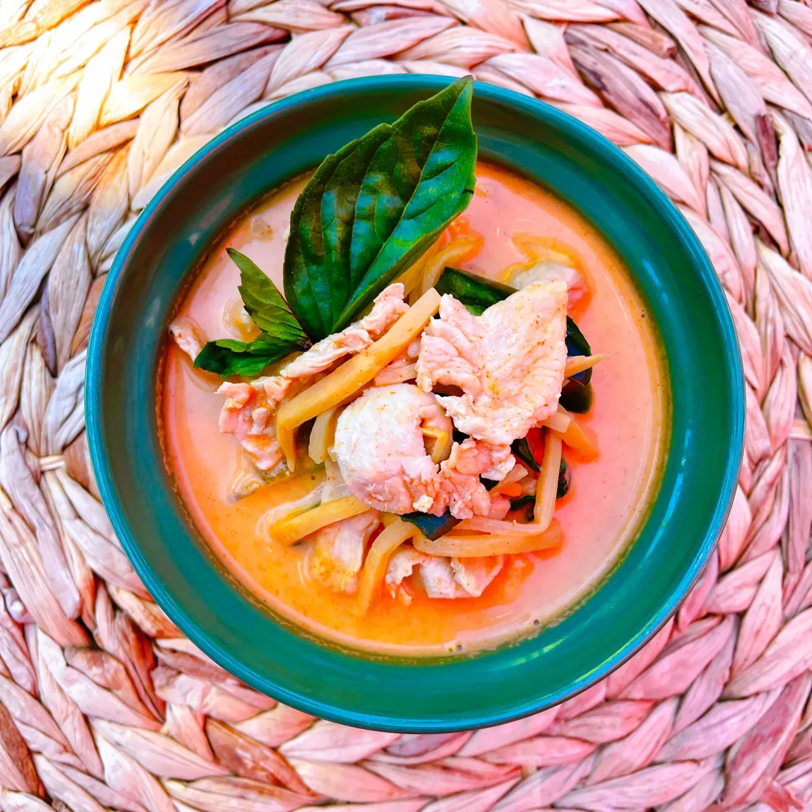 Thai red curry Gang Pedd with bamboo shoots, coconut milk and basil leaves