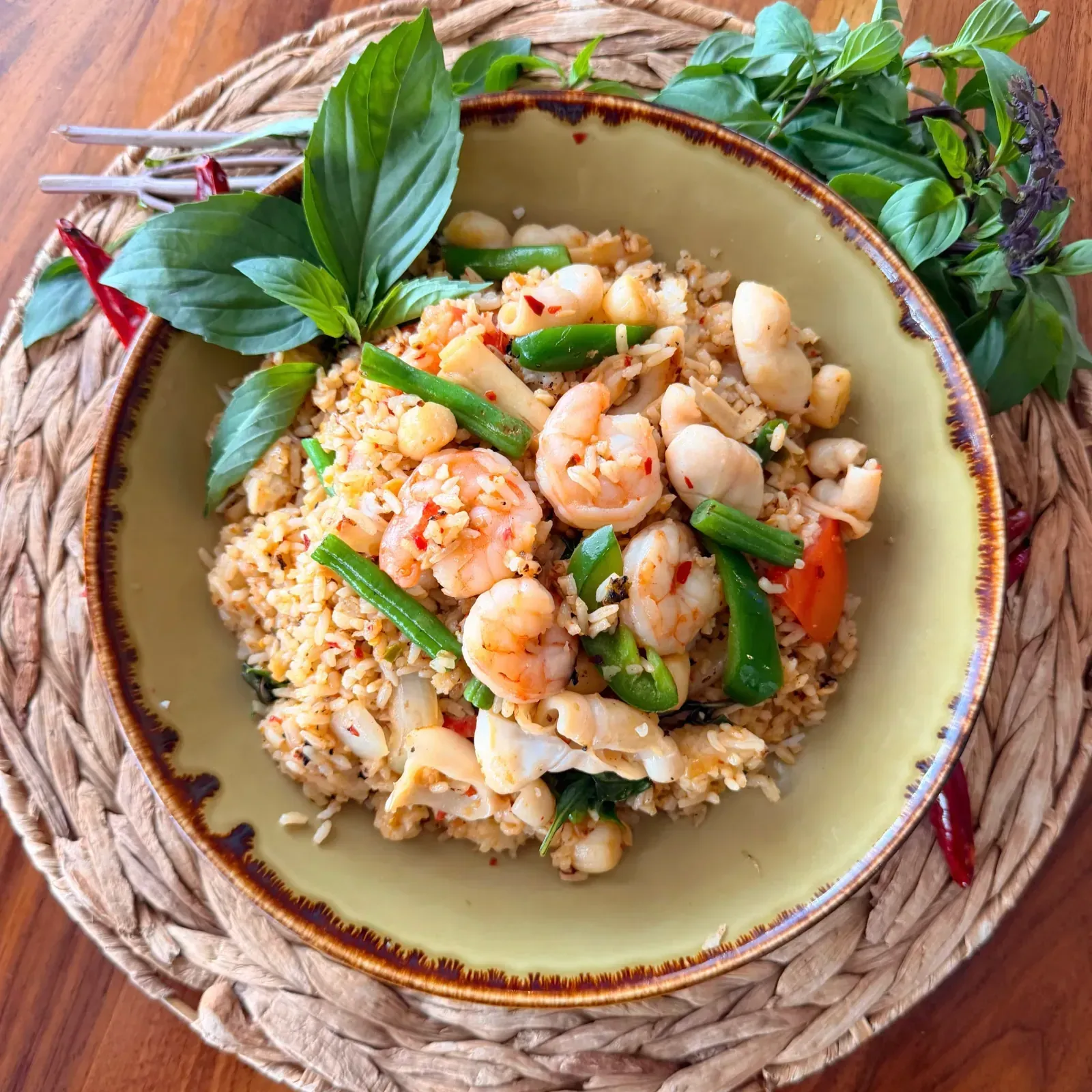 Spicy seafood fried rice with mixed seafood, basil leaves, spices and chili peppers