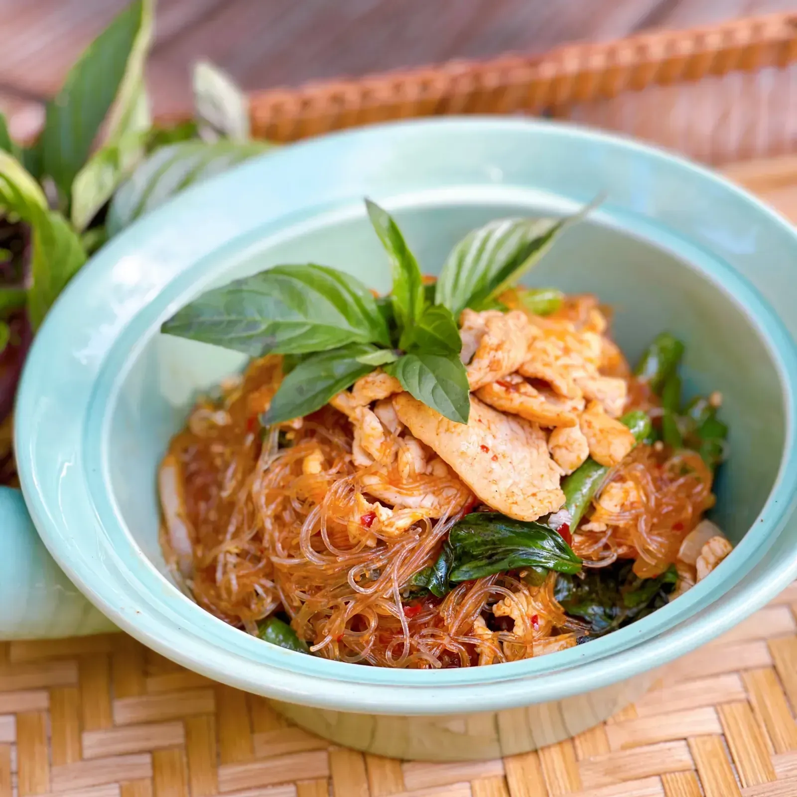 Glass noodles stir-fried with shrimp, chicken, Thai basil and mixed vegetables