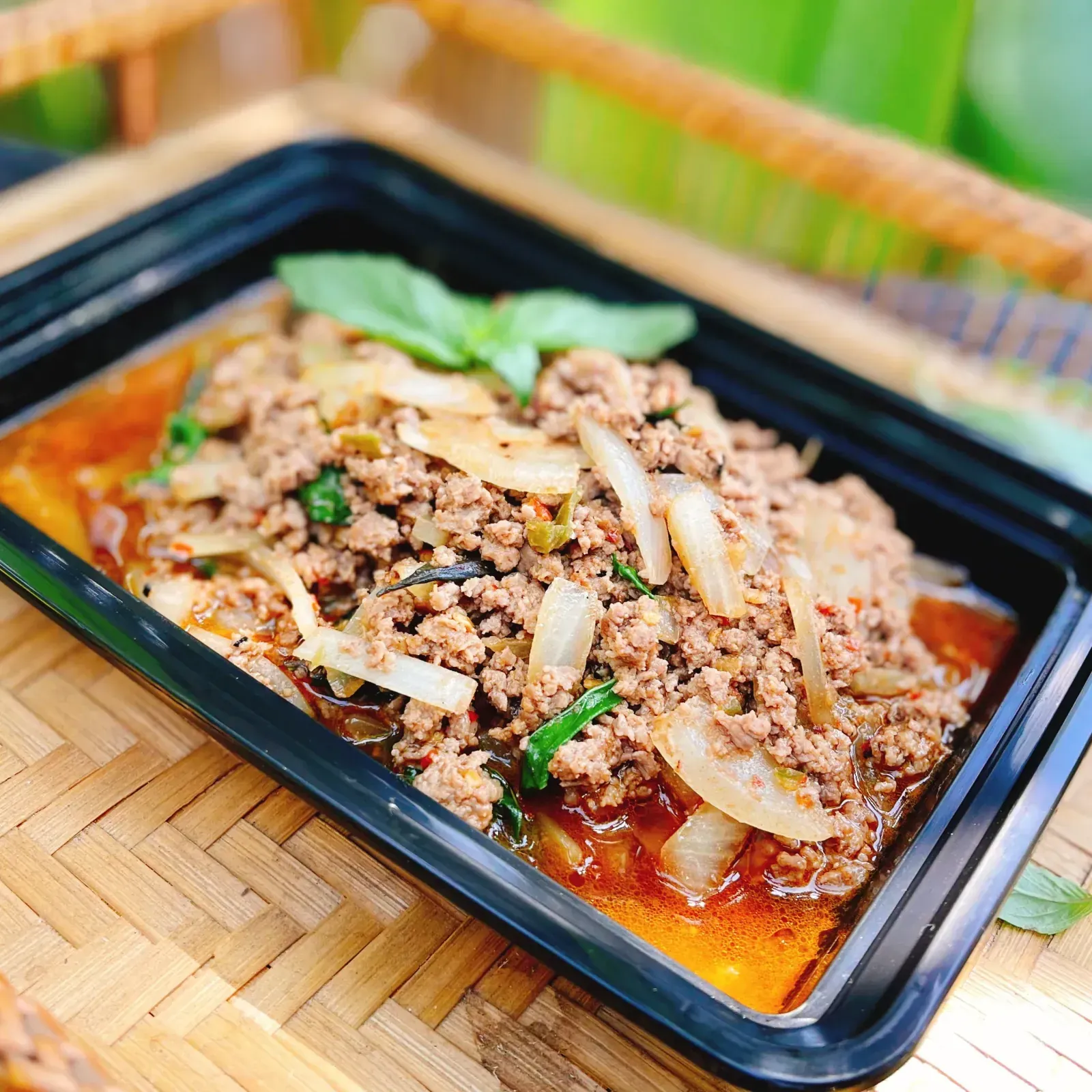 Thai basil chicken pad kra pow stir-fried with chili and garlic sauce