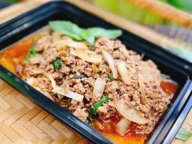 Thai basil chicken pad kra pow stir-fried with chili and garlic sauce