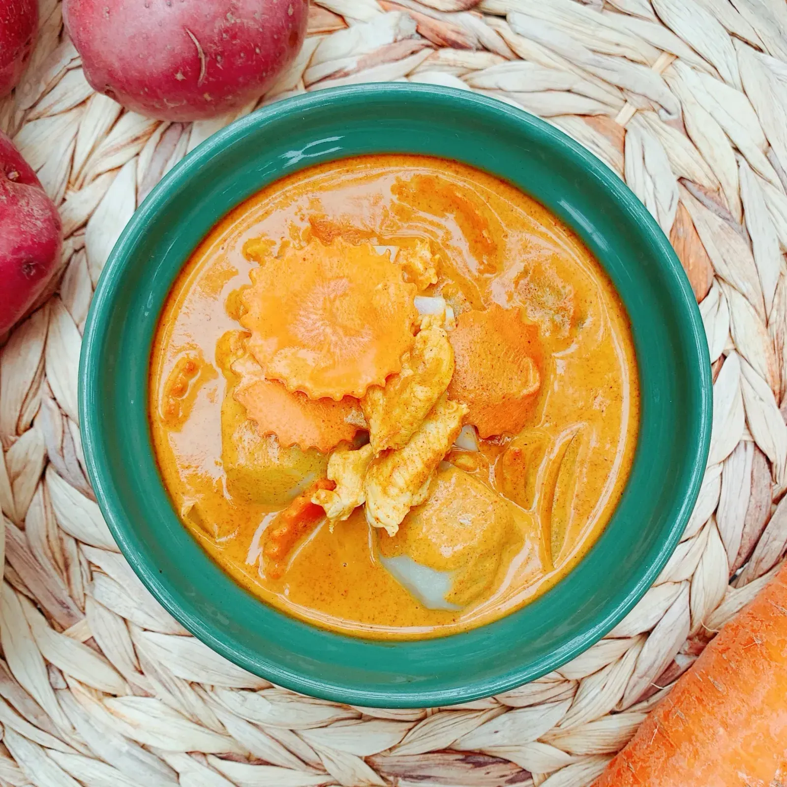 Thai yellow curry Gang Karee with potatoes, onion and carrots in coconut milk